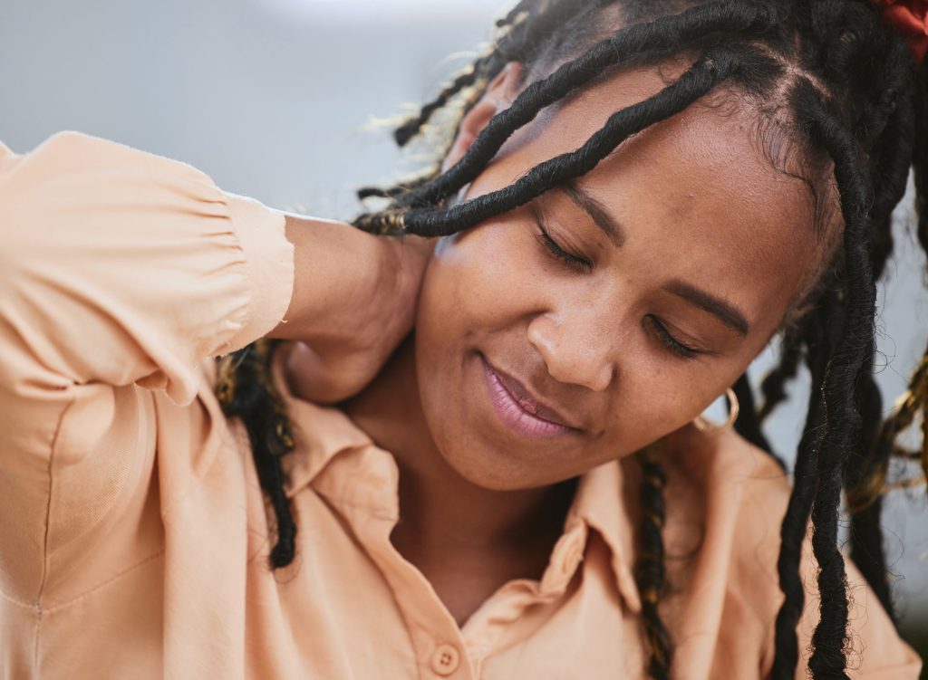 Stressed woman with neck pain.
